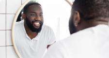 Man looking into mirror